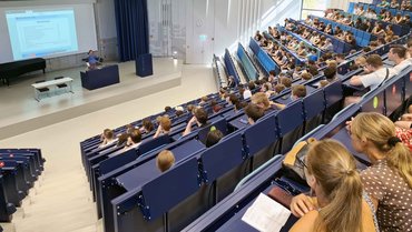 Students sitting in the auditorium.