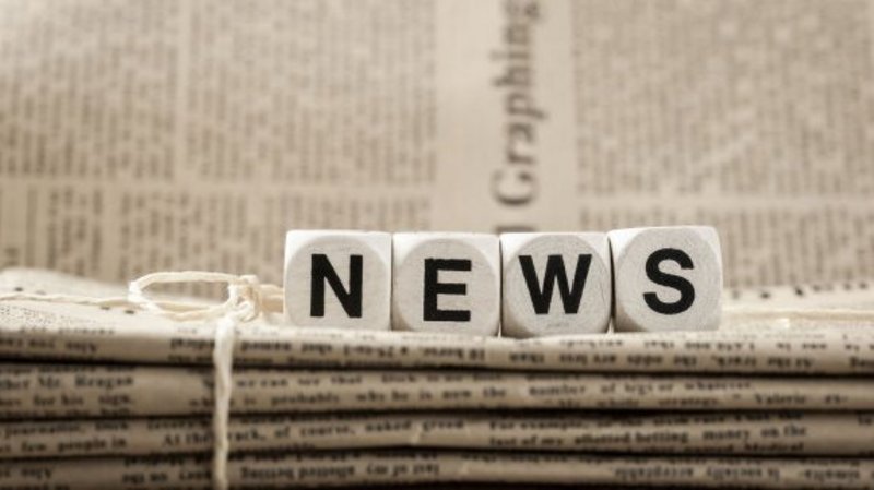 A photo of blocks spelling the word news