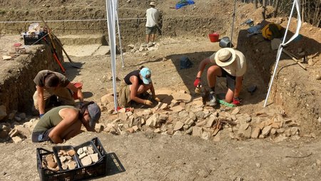 Several people at an archaeological excavation