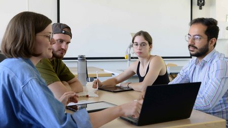 Studies at a table